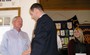 Jim Rayburn is congratulated by President Greg Gullo, with Kim Sorel to the right.